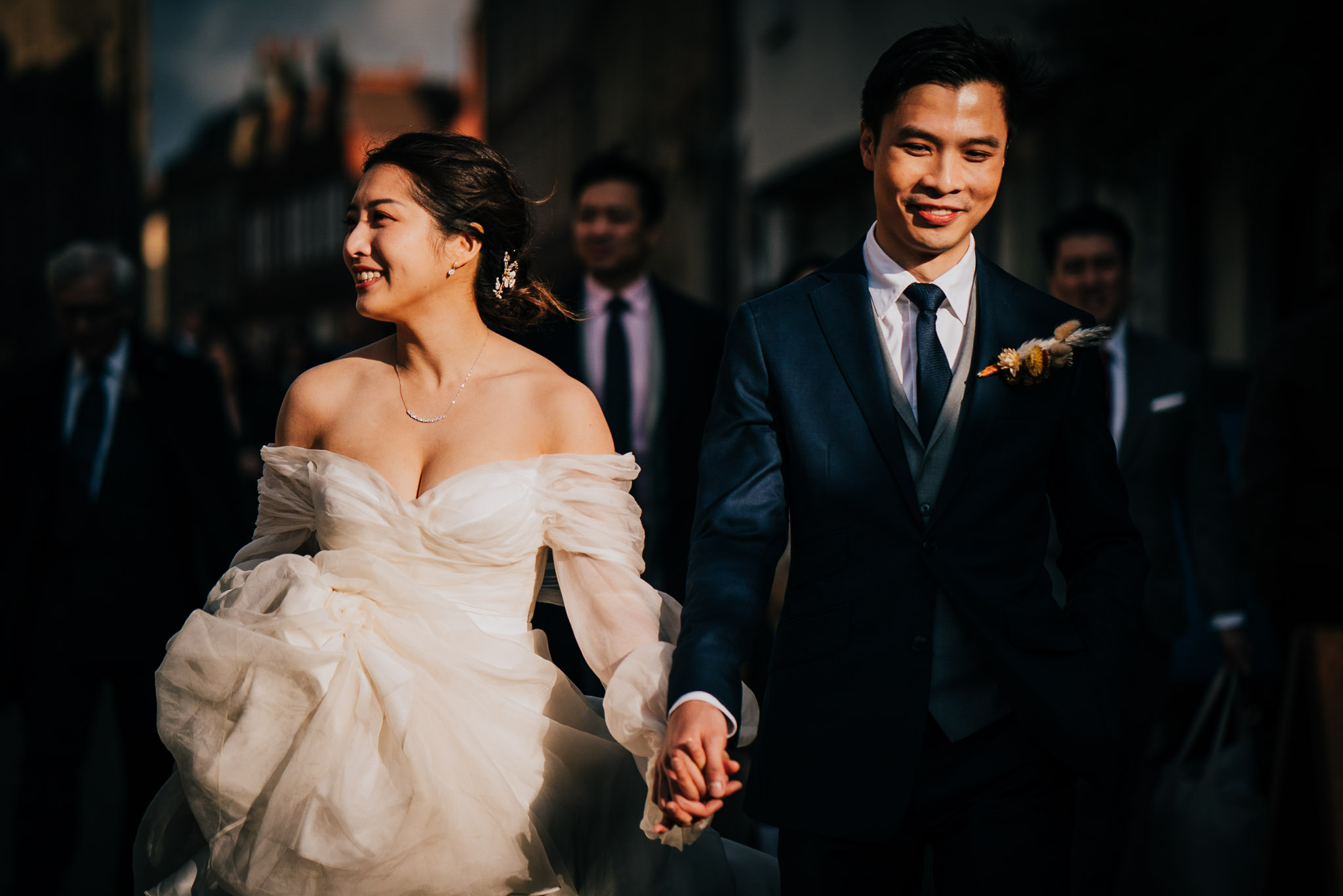 Andrew and Audrey (the bride and groom) in lovely light as they walk to their punting experience in Cambridge