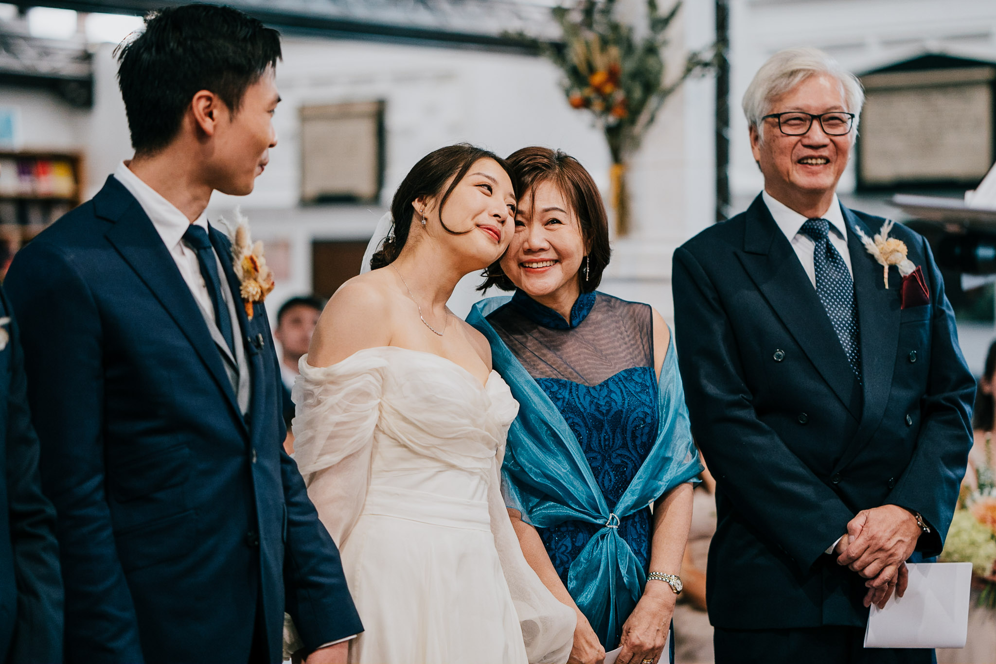 During their wedding ceremony at St Andrew the Great, Audrey and her mum touch heads.