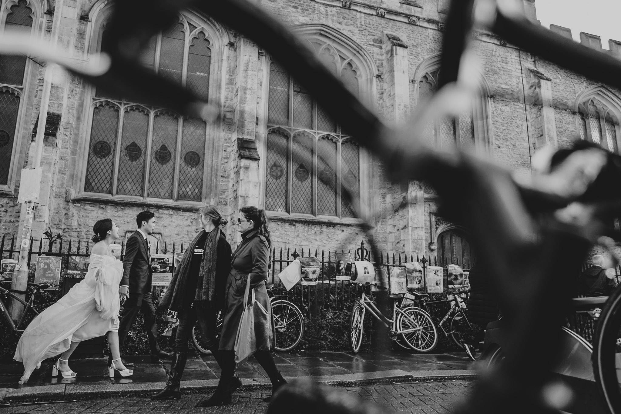 Audrey and Andrew walking through Cambridge after their wedding ceremony at St Andrew the Great.