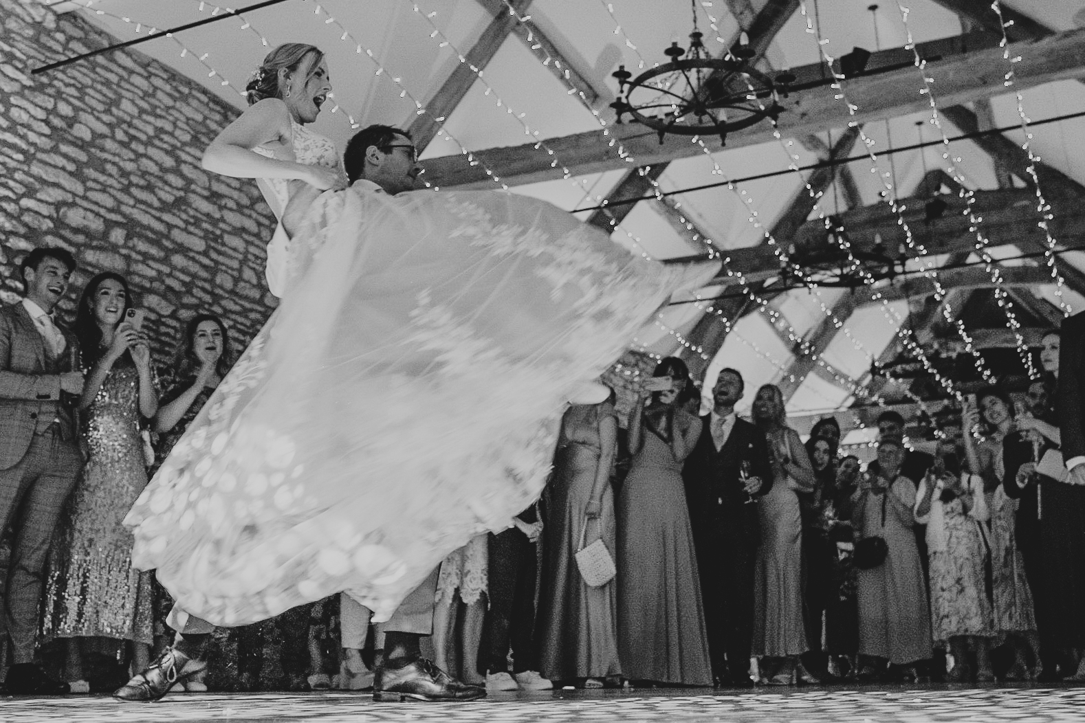 Groom lifts his bride during their First Dance at Caswell House.