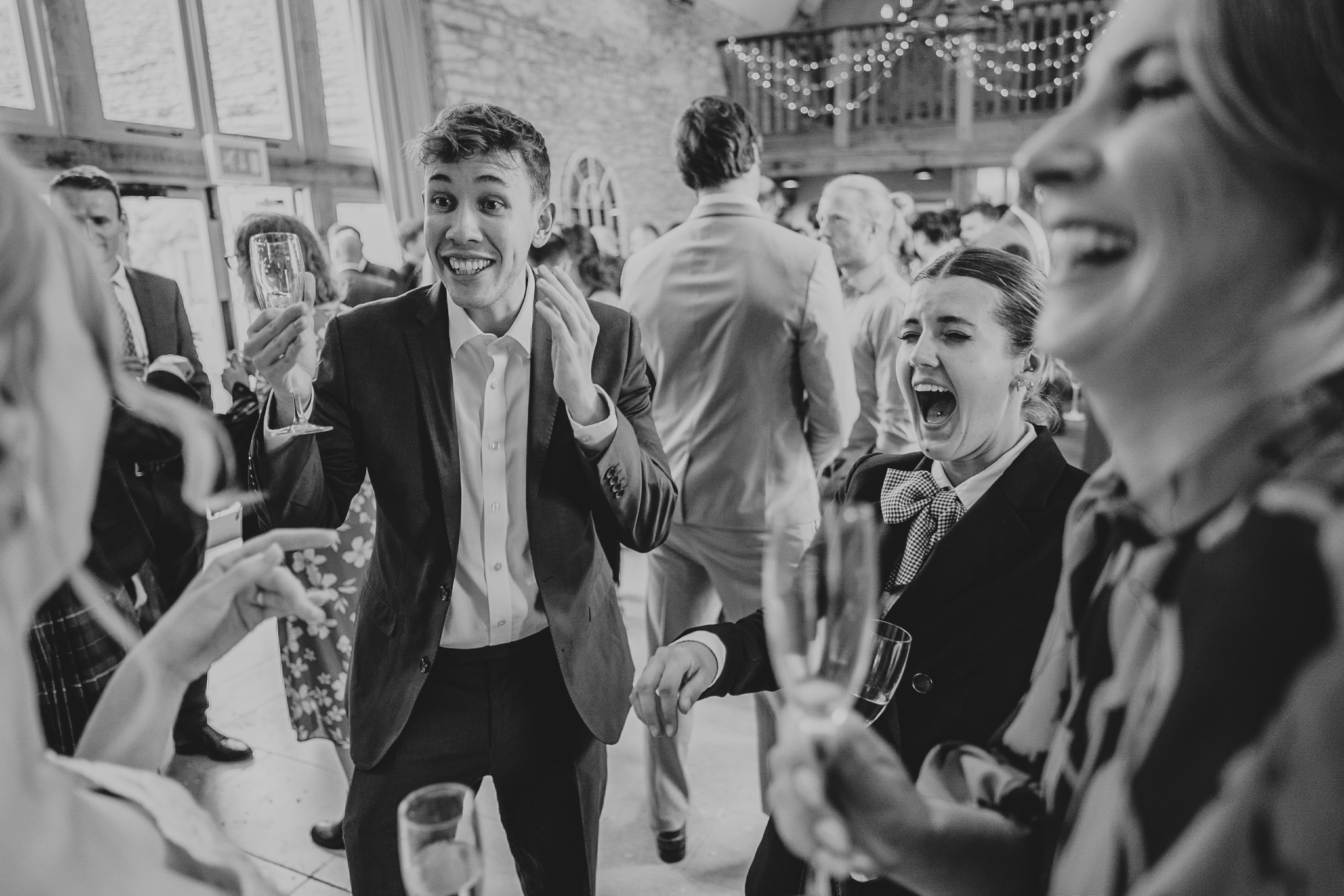 Guests laughing and drinking at Caswell House.