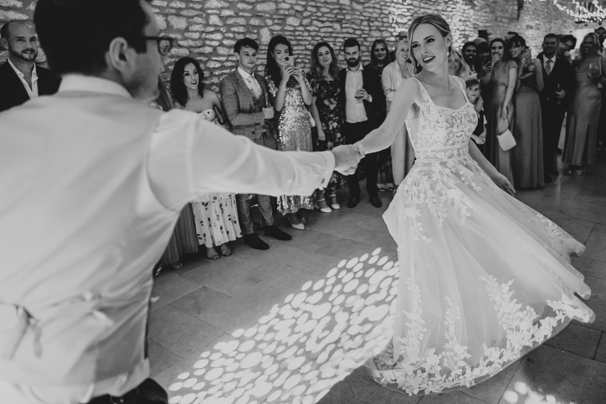 A close-up action shot of their First Dance at Caswell House.