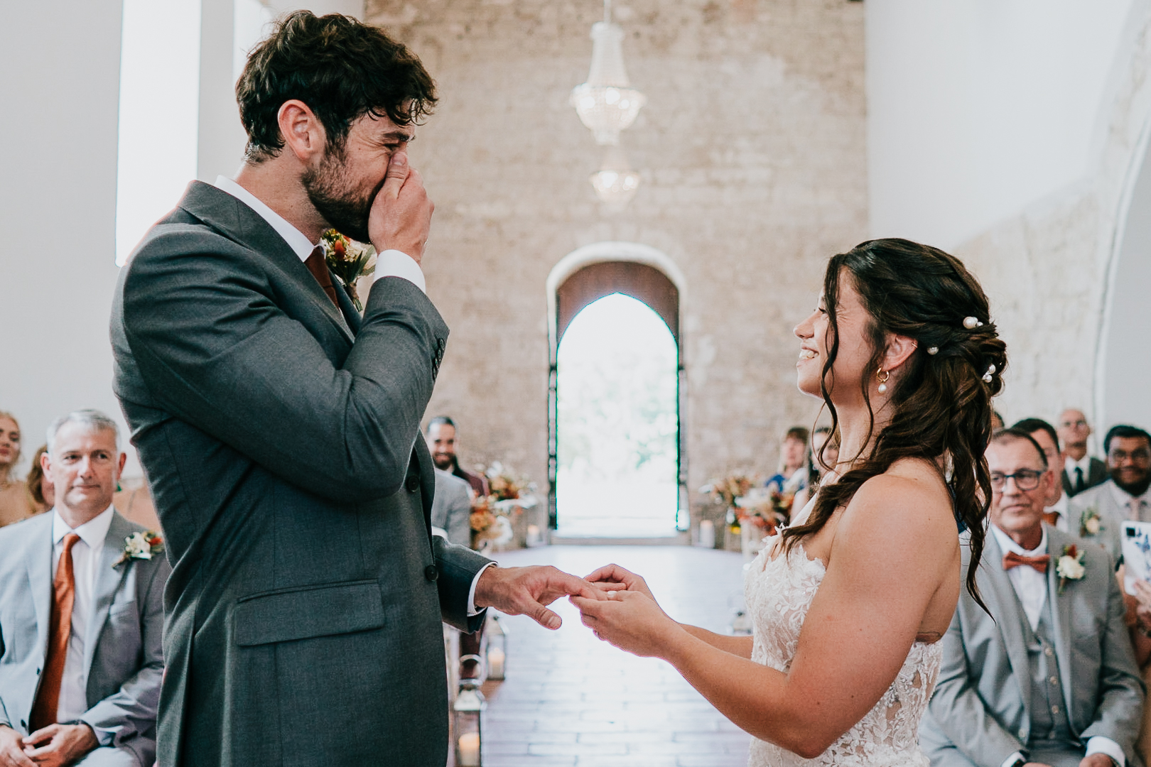 chateau-de-st-paul-wedding-photographer 1 – Alan Law Photography The groom tries to keep himself together as the bride places his ring on his finger at Château de St Paul, France.