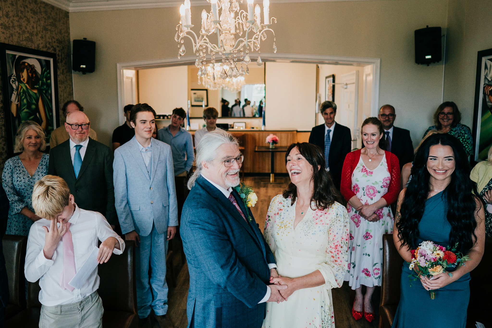 A wedding ceremony at The Horn of Plenty; shot from above, the groom and bride sharing a laugh.