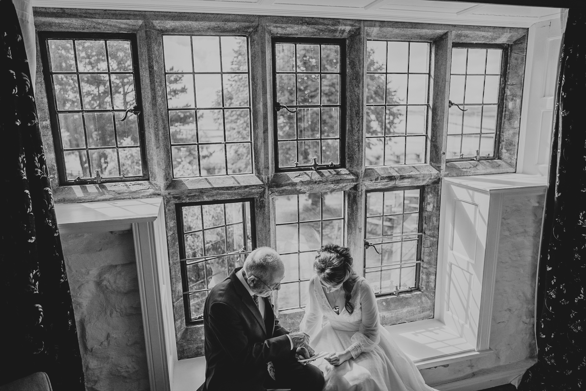 lynton-town-hall-wedding-photographer 2 – Alan Law Photography The bride and her Dad, in front of some large windows, go through his speech before the upcoming wedding