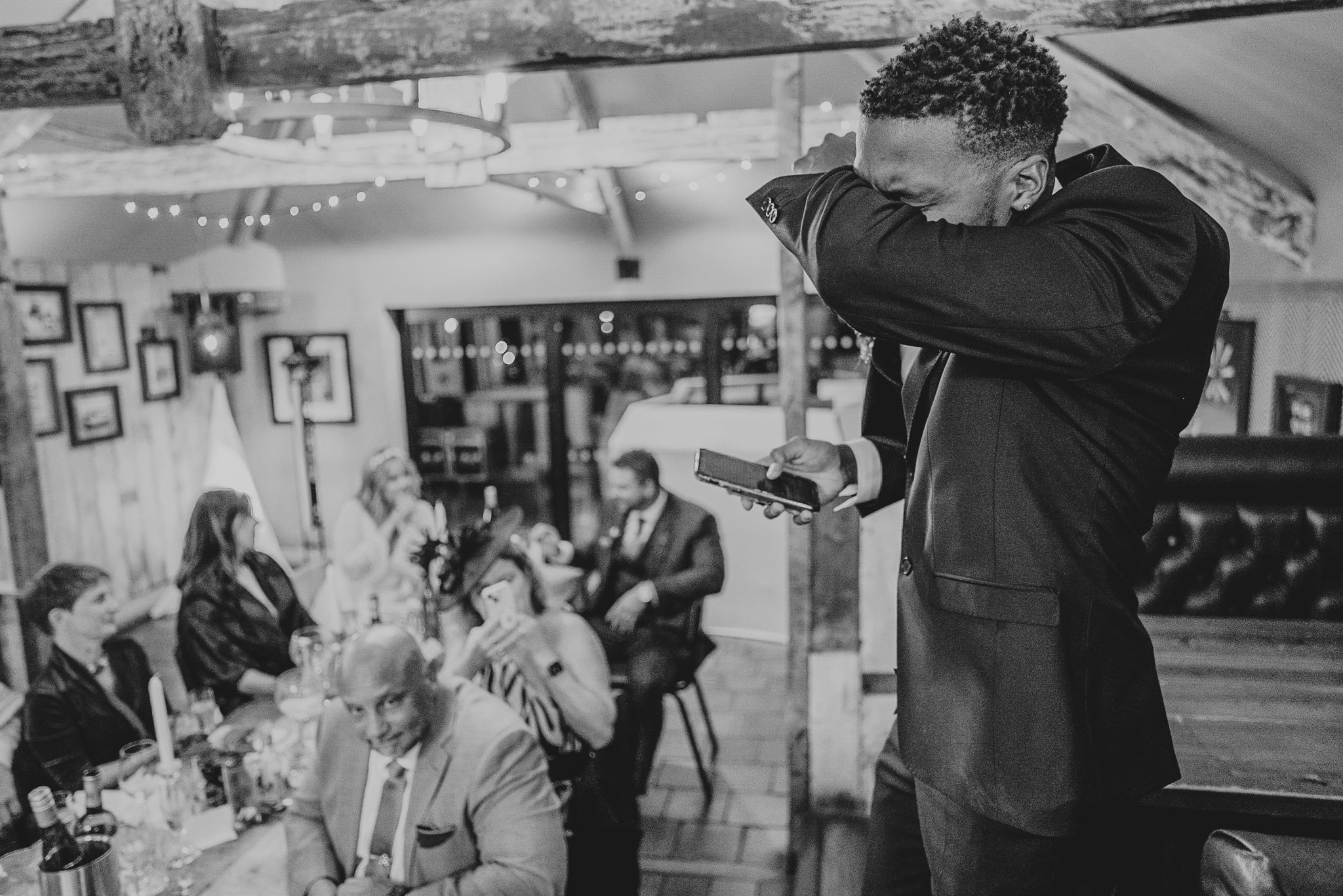 pengersick-castle-wedding-photographer 8 – Alan Law Photography The Best Man wipes away tears during his speech at The Chain Locker, Falmouth.