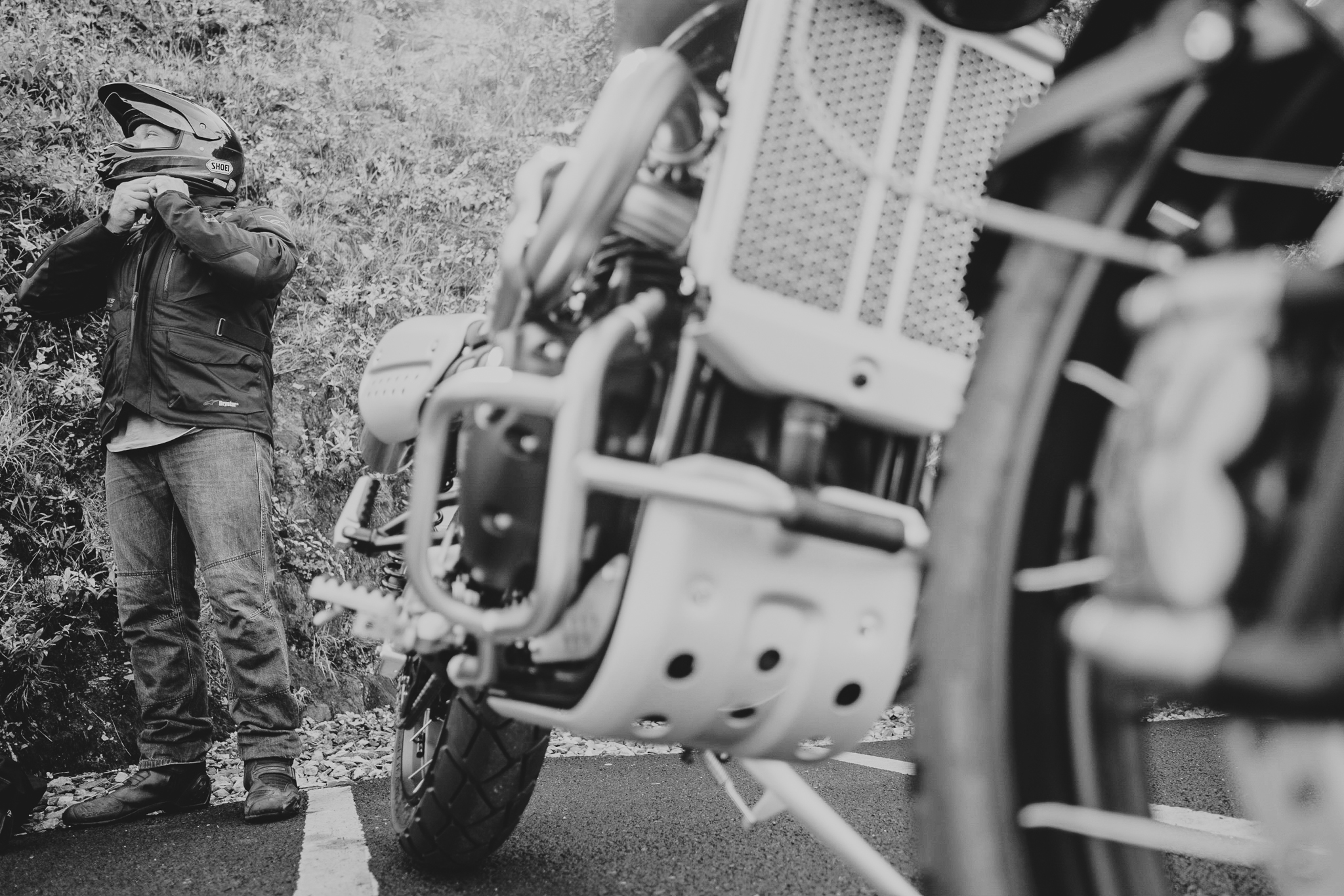 A low shot of Andy getting his helmet on, as he's about to try his suprise wedding gift out: A limited edition, brand new motorbike.
