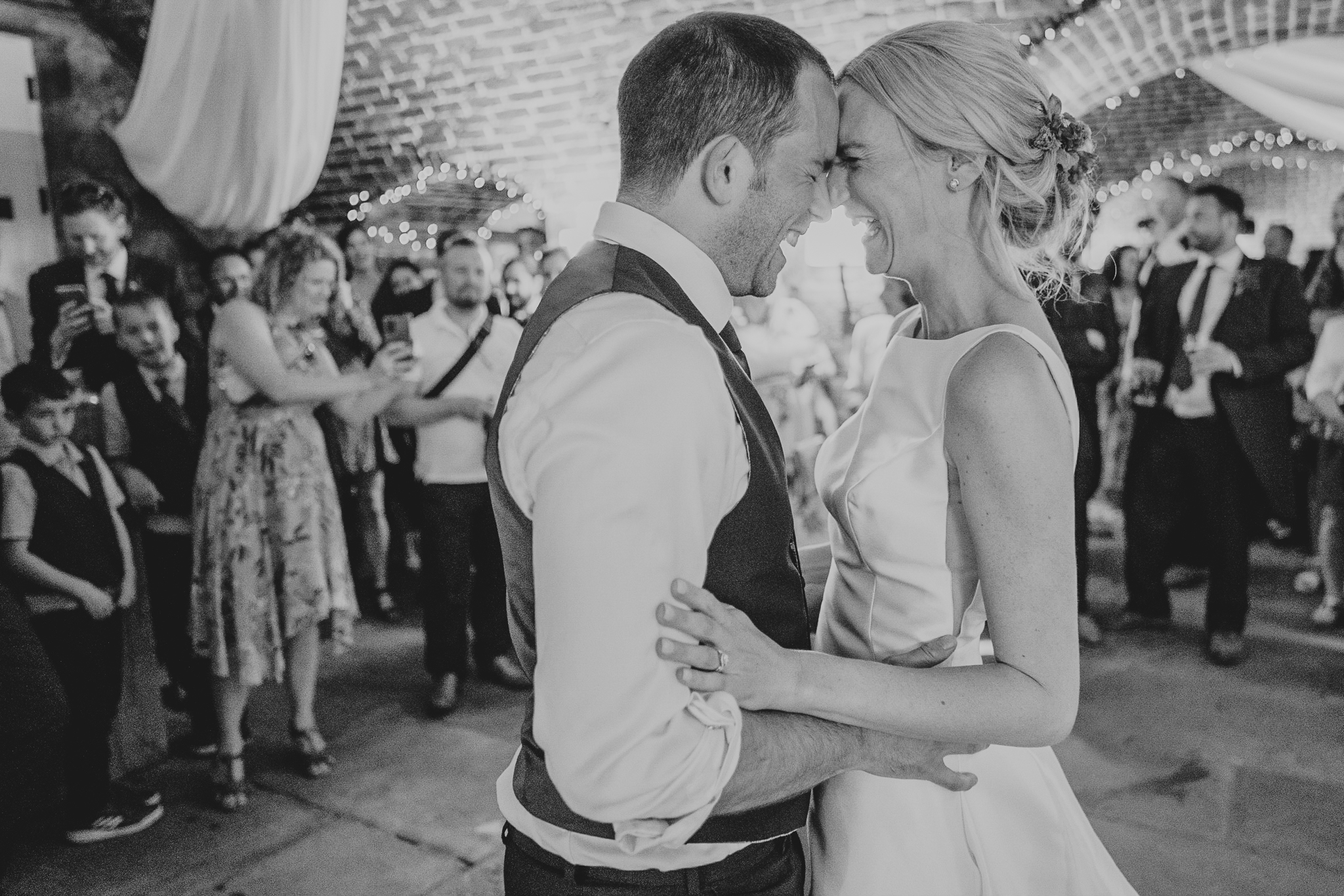 polhawn-fort-wedding-photography 9 – Alan Law Photography The couple touch heads and laugh during their Polhawn Fort First Dance.