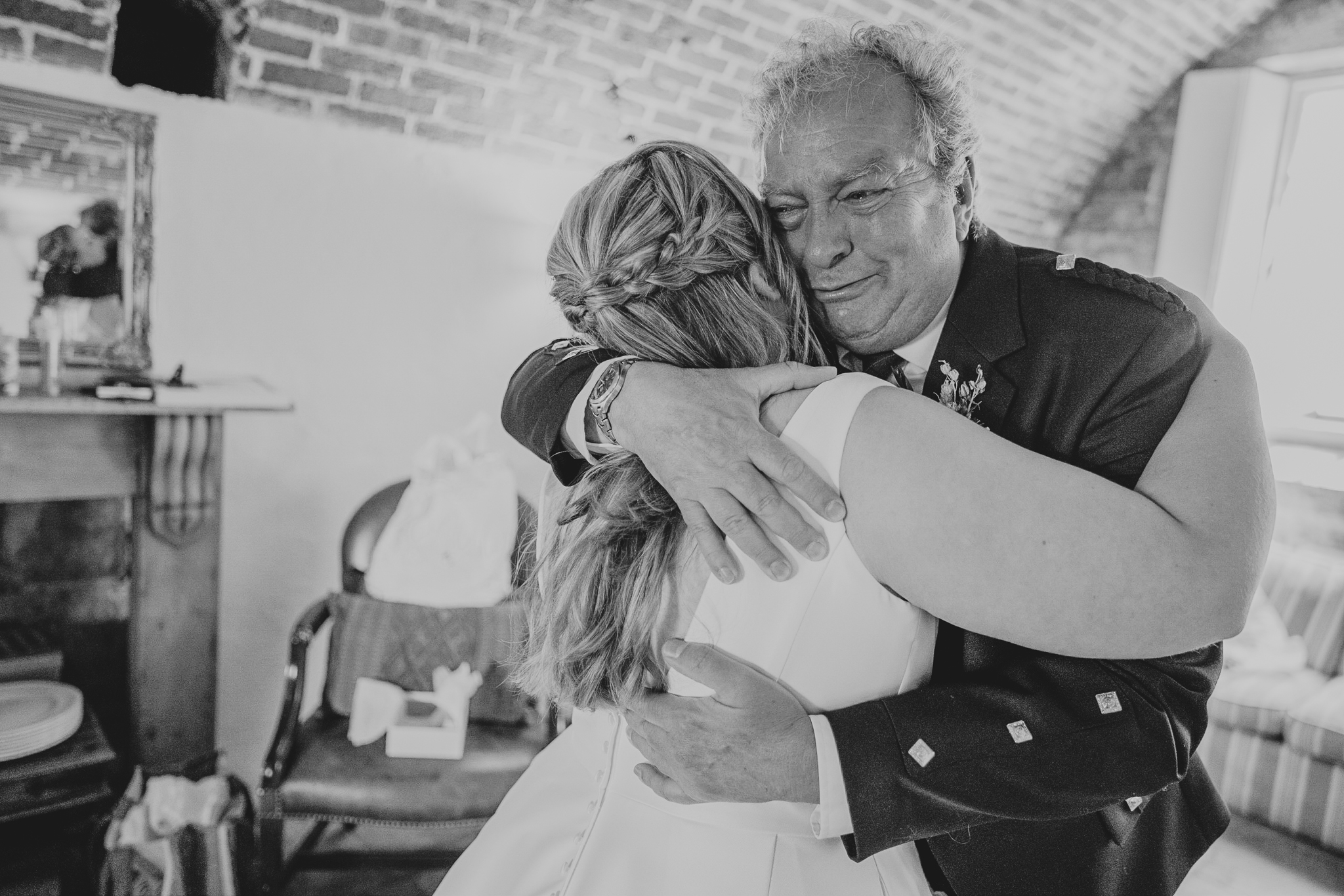 polhawn-fort-wedding-zarra-chris 10 – Alan Law Photography Father of the bride hugging his daughter, visibly emotional, at Polhawn Fort.