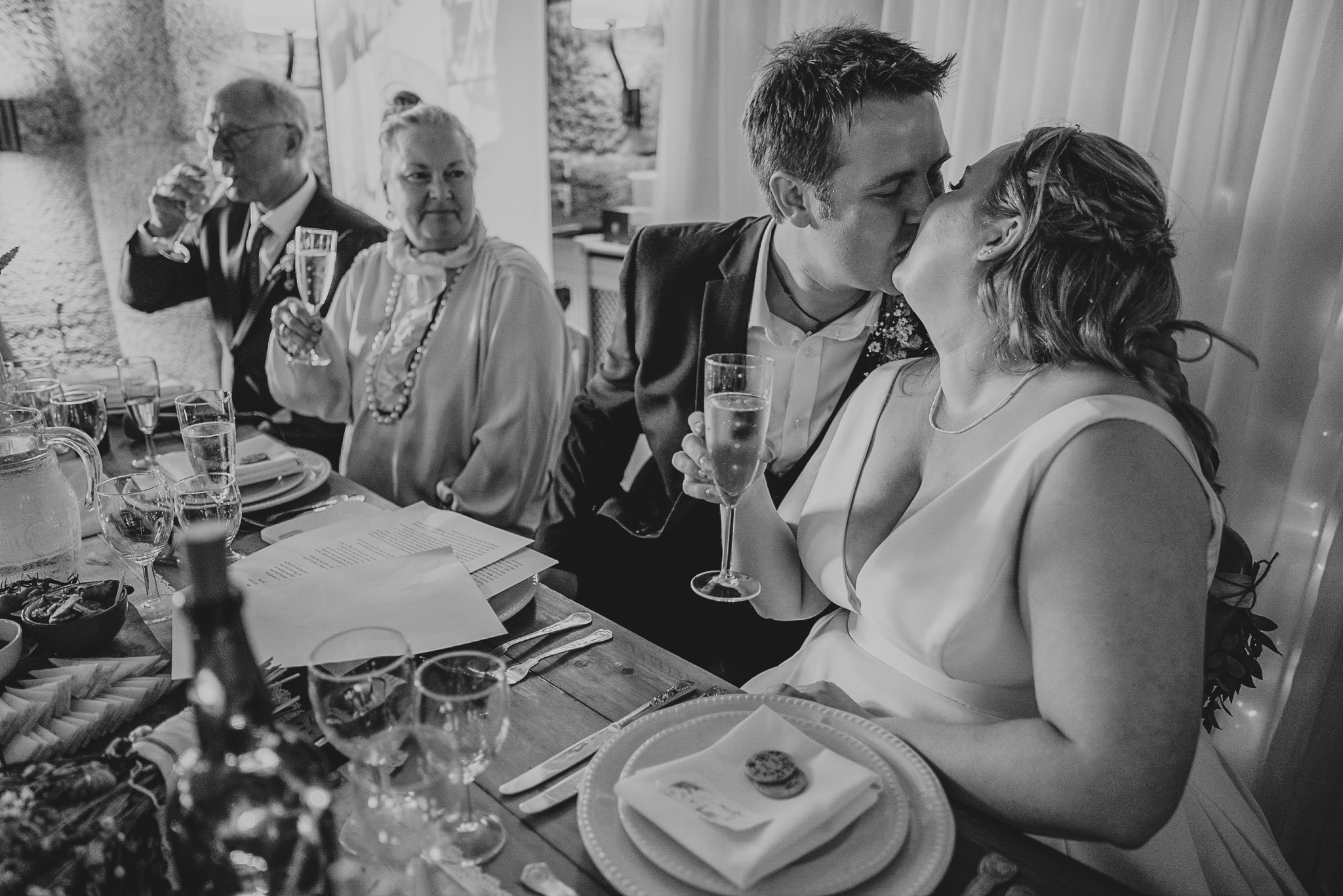 polhawn-fort-wedding-zarra-chris 5 – Alan Law Photography Chris and Zarra embrace after a speech at Polhawn, Cornwall.