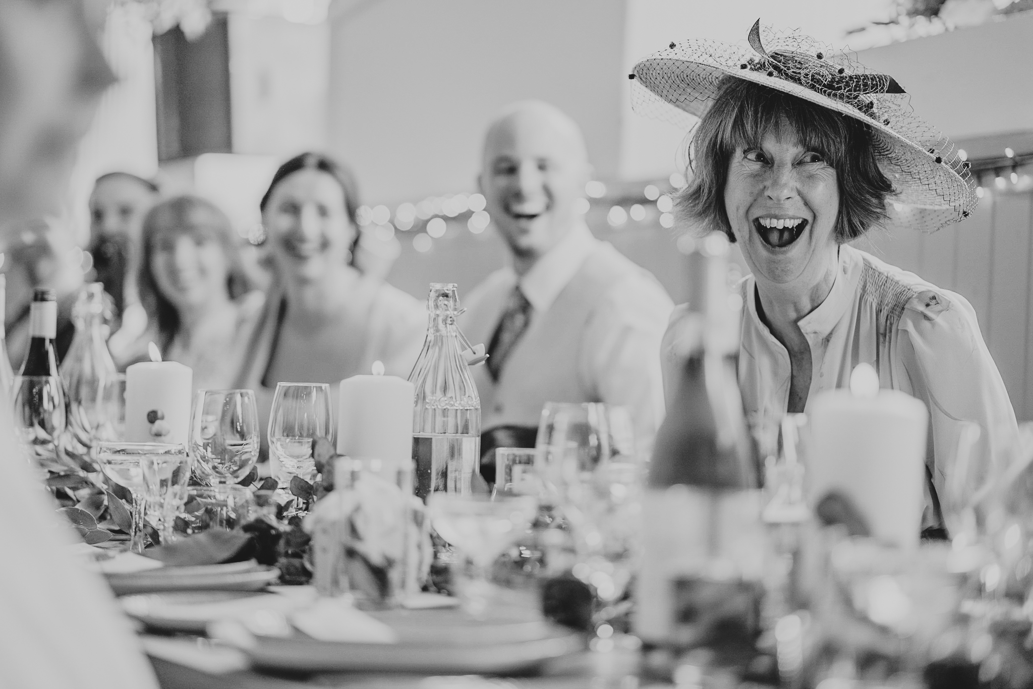 port-isaac-wedding-photographer 9 – Alan Law Photography Olivia's mum has a shocked-slash-laughing face during the speeches at Port Isaac Village Hall.