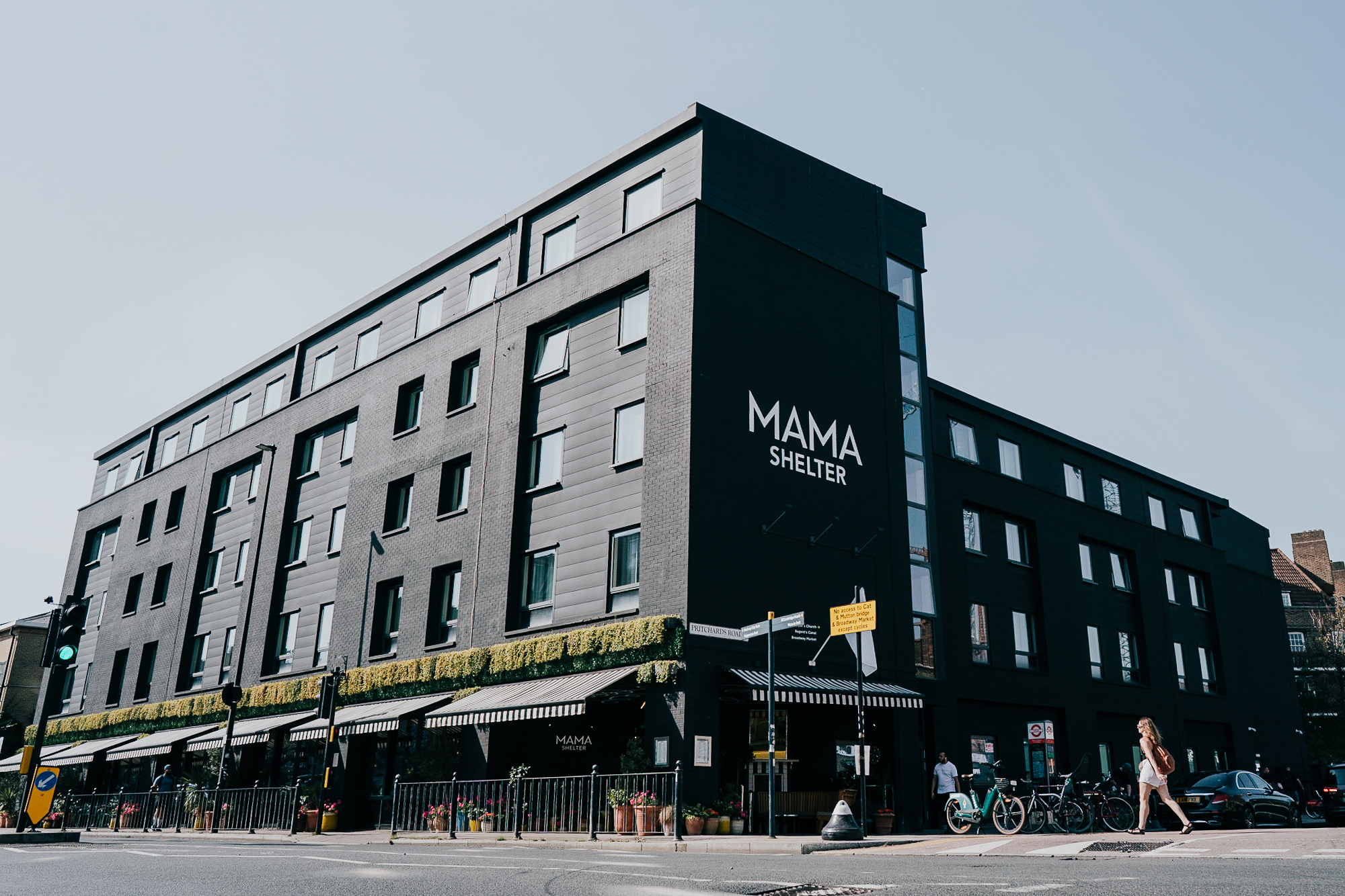 Mama Shelter in London, a wide shot, with someone walking in the foreground.