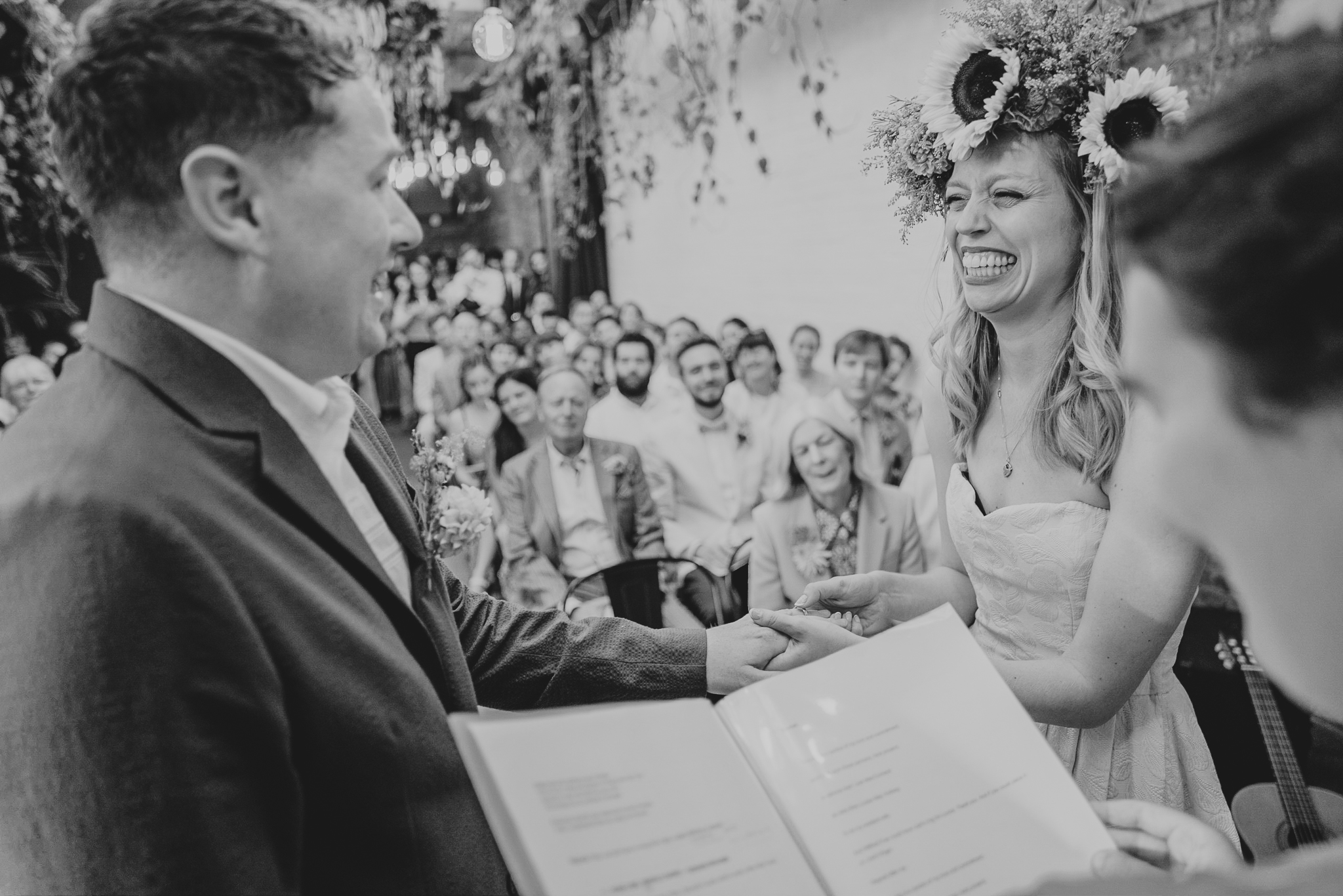 The couple laugh at each other during their The Hackney wedding ceremony.